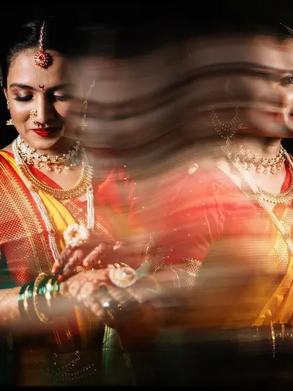An artistic shot using slow shutter speed to create a motion blur effect. This captures the bride's multiple expressions in one frame, adding a dynamic and ethereal quality.