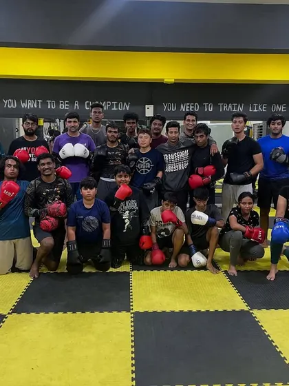 Geared up and ready to go. Our members pose together after a boxing session, united in the grind.