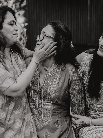 A beautiful, candid moment of affection between three generations of women. A tribute to the strength and love of mothers.