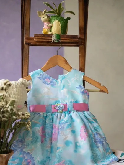 A beautiful dress in watercolor shades of blue and pink. The simple silhouette allows the ethereal, artistic print to be the star of the show.