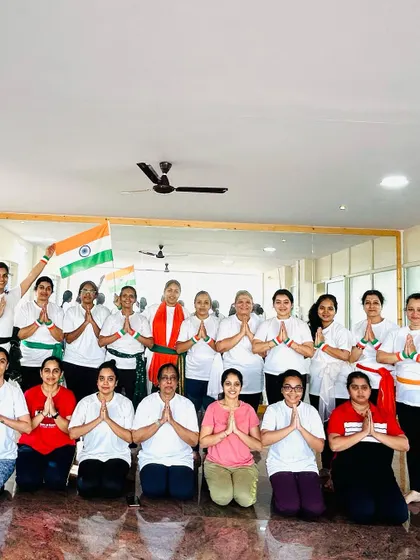 The entire class in a prayer pose, offering gratitude on Independence Day. A moment of peace and unity.