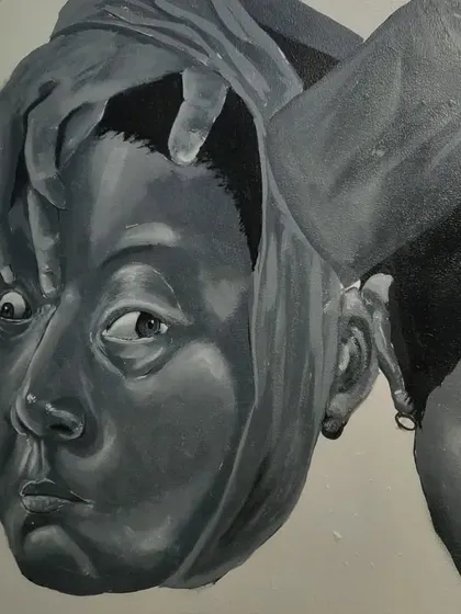 A close-up of the character whose face is being pulled back, revealing wide eyes underneath. This represents a state of surprise or revelation.