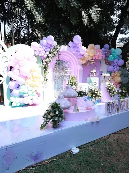 A wider angle of the spring butterfly party, showing how the stage is nestled into the beautiful green landscape. Outdoor events have a special magic of their own.