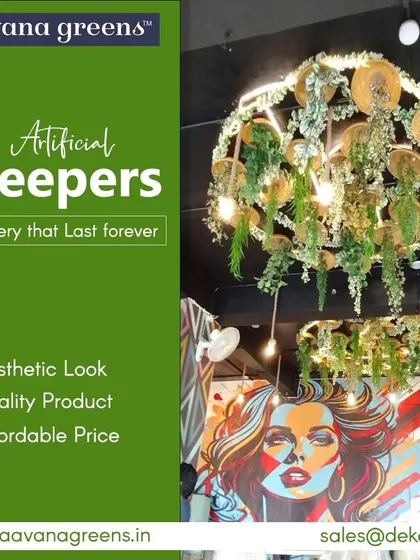 Our artificial creepers offer an aesthetic look with quality materials at an affordable price. This chandelier, adorned with hanging greenery, is a perfect example of a creative lighting feature.