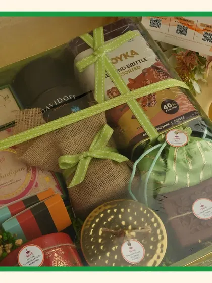 A close-up of the contents of the green hamper, showing the variety of premium products included.