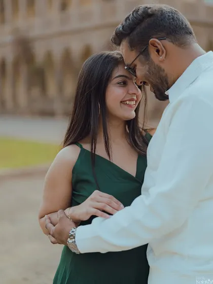 A beautiful, tight close-up capturing the shy smiles and intimate connection of a couple's embrace.
