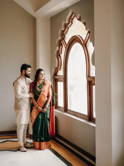 A beautifully composed shot using the window as a frame. This portrait from an engagement shoot has a very elegant and thoughtful mood.