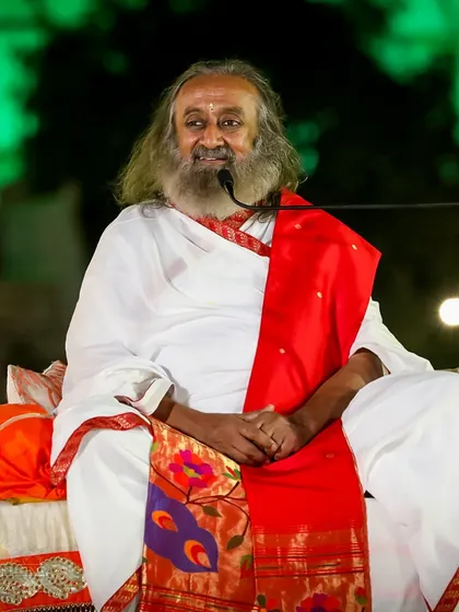Gurudev seated on stage during the Independence Day satsang. The evening is a beautiful blend of spirituality and patriotism, celebrating the freedom of the nation and the soul.
