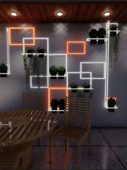 This innovative wall feature was designed during lockdown to bring art and nature together. The geometric shelving unit is backlit and interspersed with small planters, turning a simple wall into a living art installation.