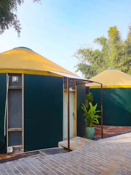 The exterior of our unique yurt-style cottages at Kanakapura, offering a one-of-a-kind stay experience.