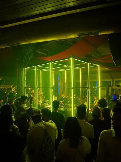 The view from the dance floor, looking towards the DJ booth inside this awesome neon cube. The lighting and production at this gig were top-notch.