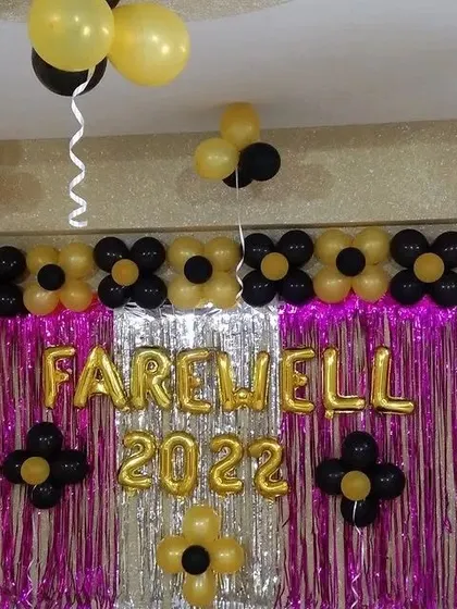 This wider shot shows how the farewell decorations fit within the office space, creating a dedicated spot for celebration and photos.