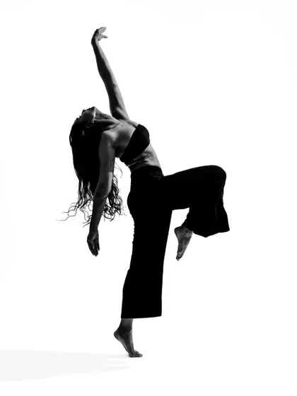 A black and white movement portrait, capturing a moment of full extension and release. These photos explore the architecture of the dancing body.