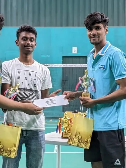 Presenting the awards to the top finishers of our 'Double Trouble' badminton tournament. We recognize champions, runners-up, and second runners-up.