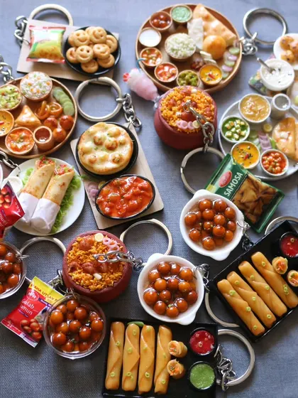 A huge collection of assorted food keychains ready to be shipped out. Each one is a tiny, handcrafted piece of art.