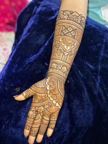 A single arm view of a detailed bridal or engagement design, showcasing the clean lines and intricate patterns.