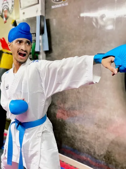 The Kiai, or martial arts shout, is used to focus energy and power into a single strike. Here, I'm practicing a Gyaku-zuki (reverse punch) on the heavy bag, a fundamental power shot in Kumite.