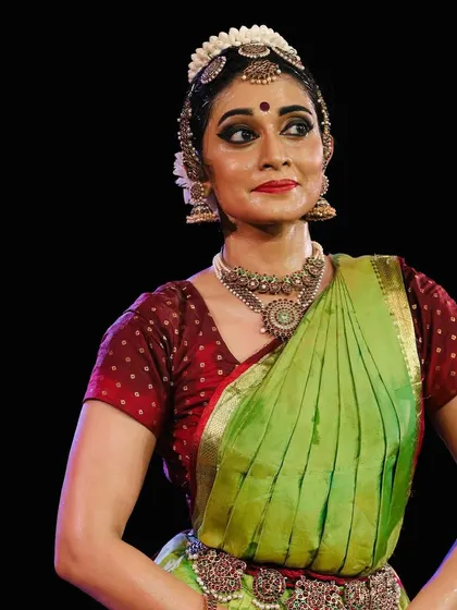 A moment of connection with the audience, a direct gaze that shares the story being told on stage.