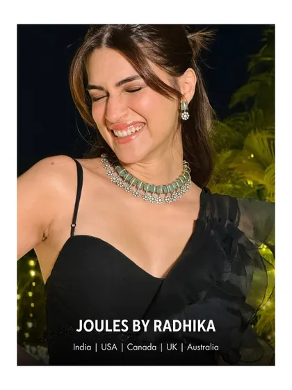 The pure joy of celebration captured in Kriti Sanon's smile, perfectly complemented by her elegant JBR choker.