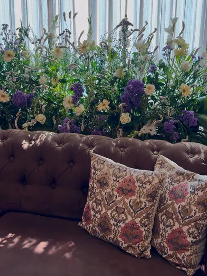 The sunlight streaming in on this beautiful floral arrangement creates a lovely interplay of light and shadow.
