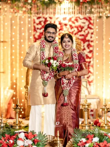 A standing portrait of Akaksh and Athira, an electrical engineer and a psychology student from Kerala. Their union, facilitated by our platform, is a beautiful blend of science, art, and spirituality.
