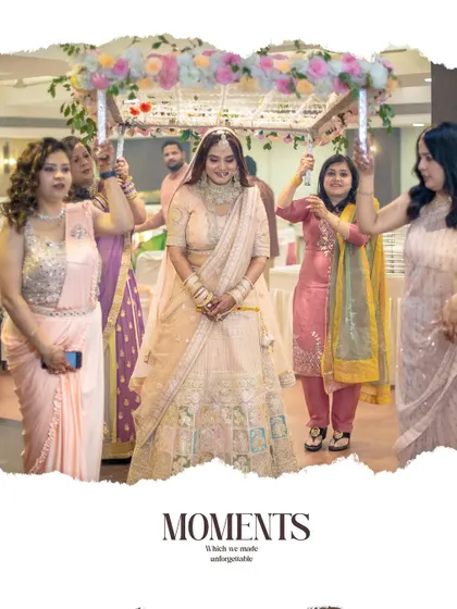 The bride's grand entrance under a 'phoolon ki chadar' held by her loved ones.
