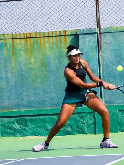 In action during the final of the ITF W25 Solapur. These photos show different aspects of my game under pressure, from hitting a running forehand to maintaining balance on a two-handed backhand.