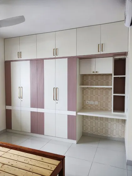 The complete bedroom setup, showing the wardrobe with study nook next to the bed frame, creating a cohesive and well-designed space.