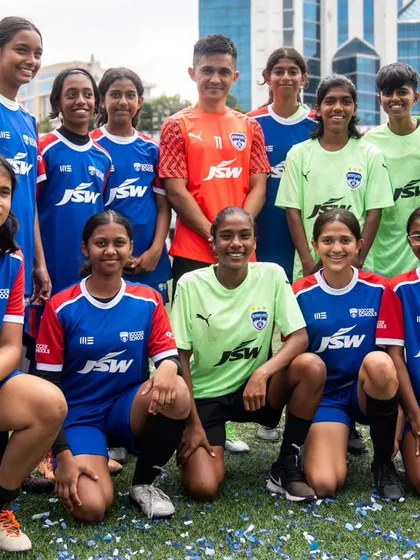 Our BFC Girls Academy players pose with a first-team player during the BFC Open House. These interactions inspire them to dream big.