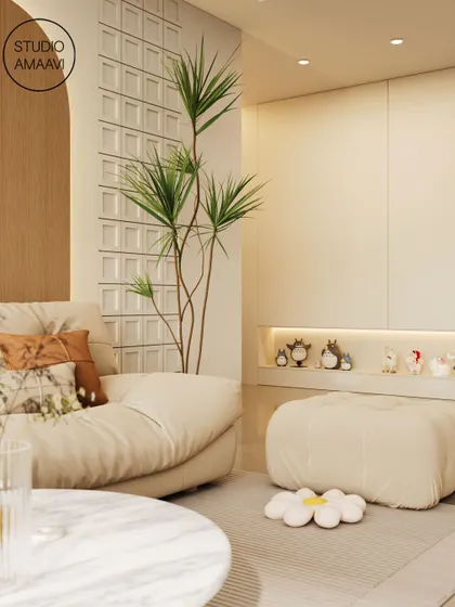 A cozy corner featuring a plush sofa and ottoman, with a built-in niche for displaying small, personal items. The use of a tall plant and textured wall panels adds depth and a connection to nature.