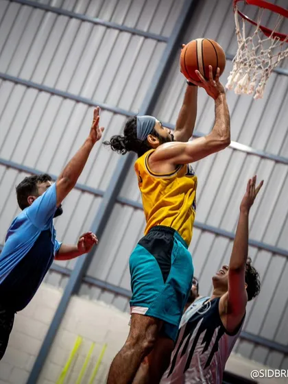 A player executing a perfect layup against multiple defenders, a common sight during our intense game nights.
