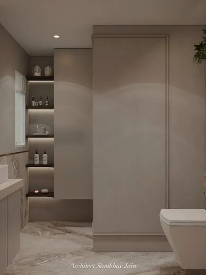 This bathroom captures the essence of raw elegance through its masterful blend of texture and tone. Fabric-look tiles with subtle moulding details wrap the walls, adding depth and a tactile softness that mimics woven material.