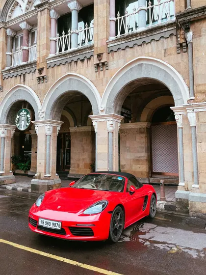 Another angle of the red Porsche, this time with the historic Starbucks building at Horniman Circle providing a beautiful architectural backdrop.