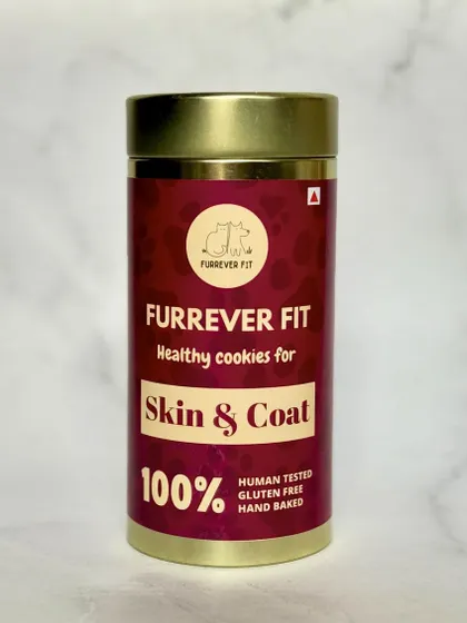 A close-up of the Skin & Coat healthy cookies packaging. The rich color comes from natural ingredients, not artificial dyes. These are hand-baked and gluten-free.