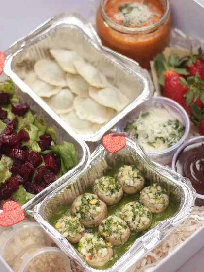 For lovers of Italian food, our Date Night Meal for 2 in the Veg option. It includes dishes like stuffed mushrooms, ravioli, a fresh salad, and a chocolate dessert.
