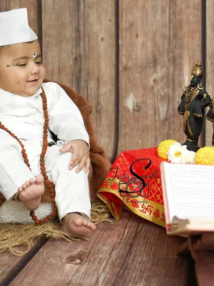 A quiet, contemplative moment. This image beautifully captures the peaceful and innocent spirit of this little Varkari.