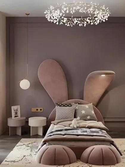 This adorable kids' room features a bed designed to look like a bunny, complete with ears and paws. The soft colors and whimsical theme create a fun and comforting space for a child.