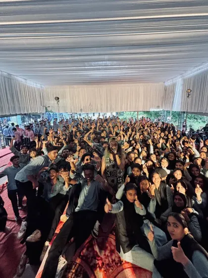 A wide-angle shot of the entire student body posing for a group photo after the show.