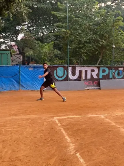 A player in the ready position, anticipating the next shot. Our training sharpens focus and court awareness for competitive matches.