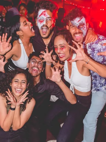 A group having a blast during our Halloween bash at Badmaash. Themed nights always bring out the most creative and fun-loving crowds.