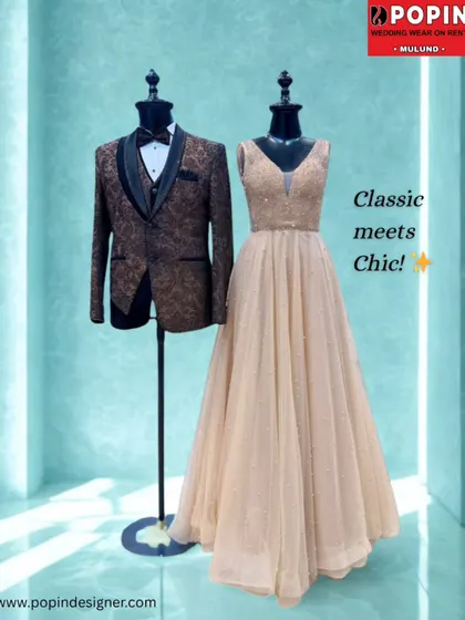 Classic meets chic with this pairing. A stunning beige gown with subtle sparkle is matched with a brown patterned tuxedo for a warm and elegant couple's look.