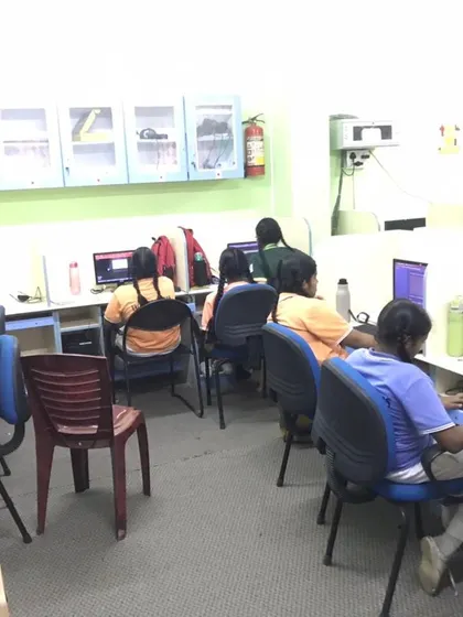 Students sit at their workstations, deeply engaged in coding during our hands-on AI and Python workshop.