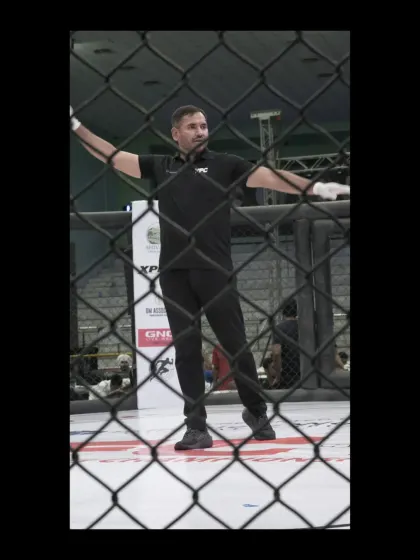 Our coach in his element, officiating a professional MMA bout. This level of experience is what we bring to every training session.