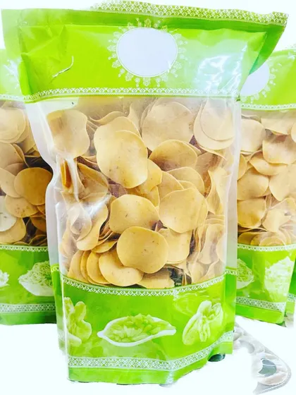 A packet of my ready-to-fry, coin-sized masala rice papads. These are a convenient and tasty option for a quick homemade snack.