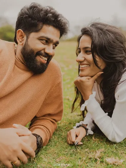 Lying on the grass and sharing a laugh, this is the kind of relaxed, candid moment we specialize in.