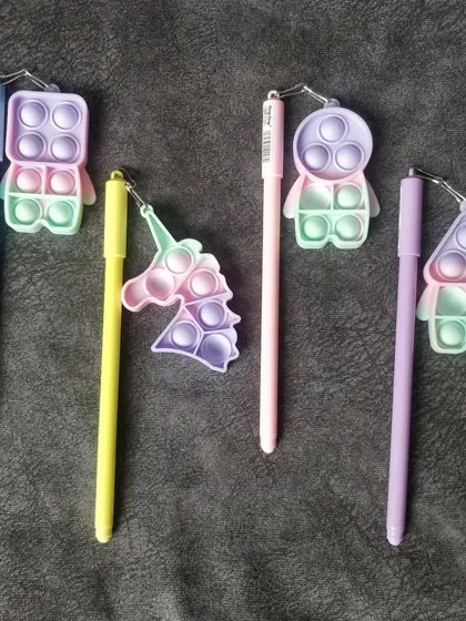 These fun pens come with a mini pop-it fidget toy attached. They are a great novelty item for kids' party bags or for anyone who loves to fidget.