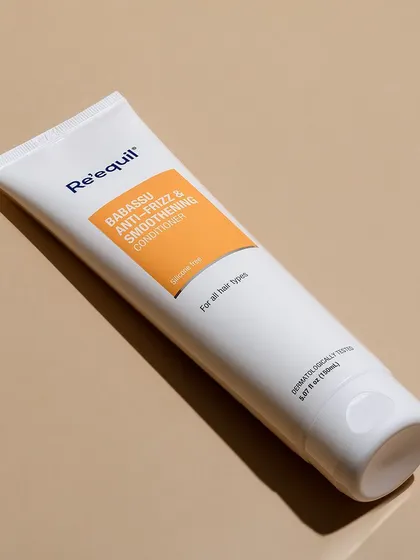 A minimalist, top-down shot of Re'equil conditioner. The clean lines and simple background emphasize the product's straightforward, effective formula, appealing to customers who value simplicity.