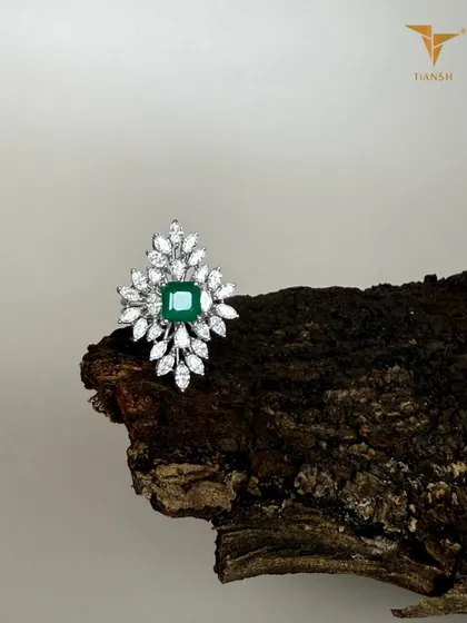 An emerald at the center, with diamonds like leaves unfolding around it. This ring feels less like a design and more like nature’s own poetry, crafted to be worn and admired.