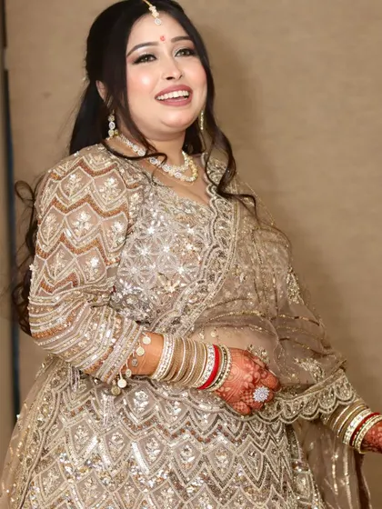 A happy and smiling bride, her joy radiating in this beautiful candid shot.