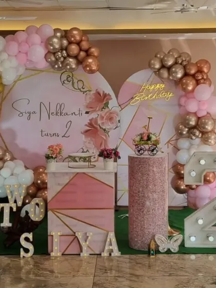 A close-up of the sophisticated butterfly-themed 2nd birthday party with modern geometric backdrops.